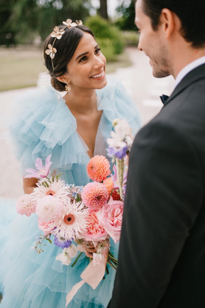 Bride wearing millia london gown and ashley wild bridal accessories.