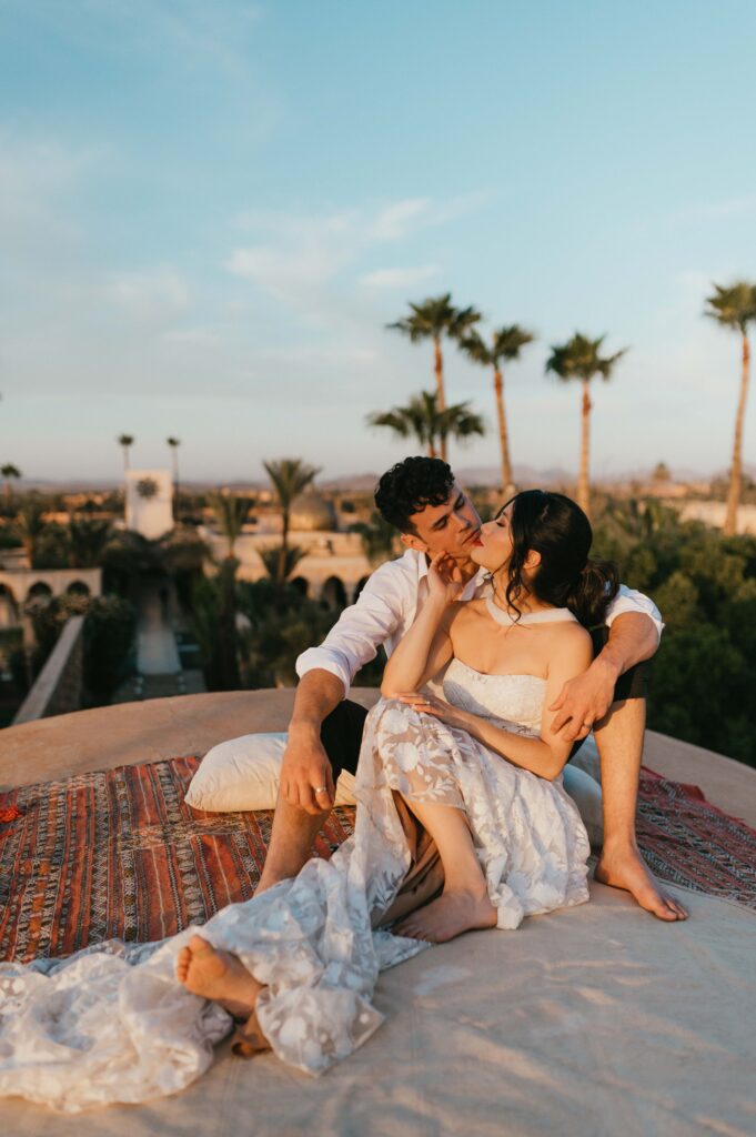 Tigue and Moira in Rue de Seine gown on rooftop of Palais Namaskar Morocco.