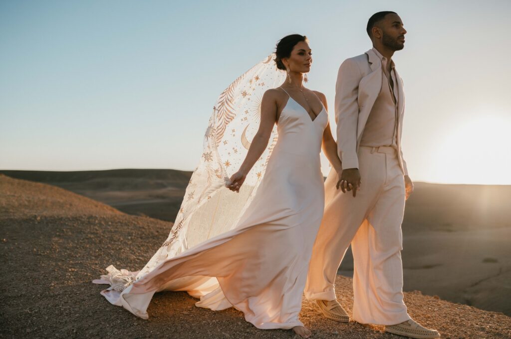 Bride megan wearing Palm Haze gown by Rue de Seine bridal.