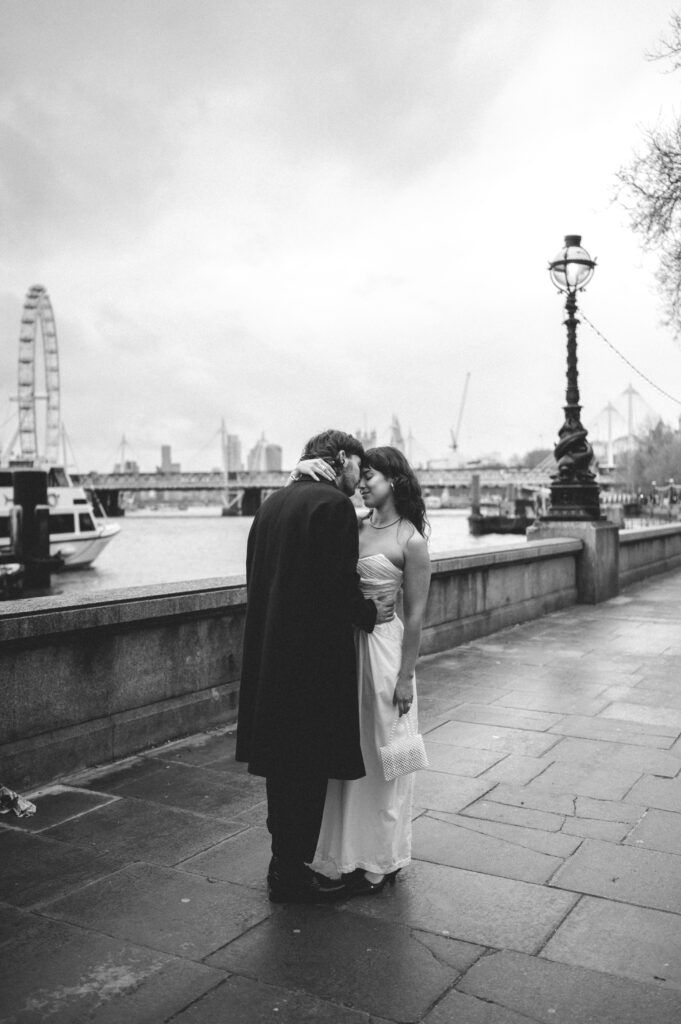 Bride and groom kissing by the big ben London. 