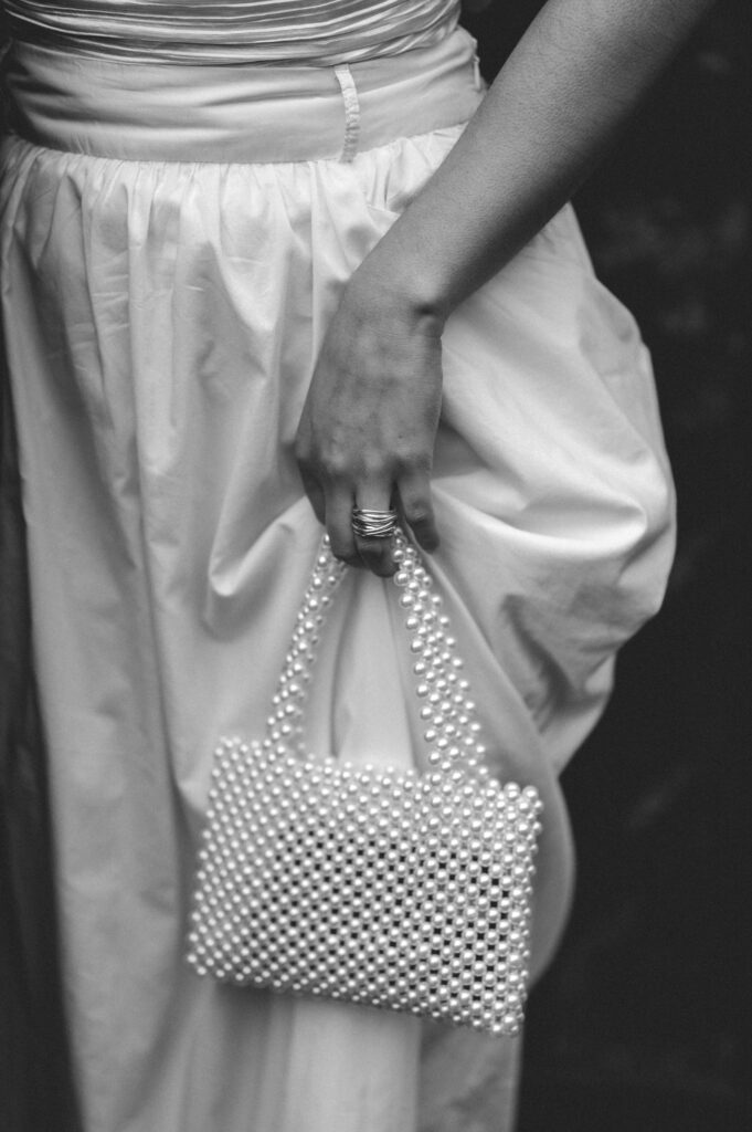 Close up of bride's pearl vintage handbag. 