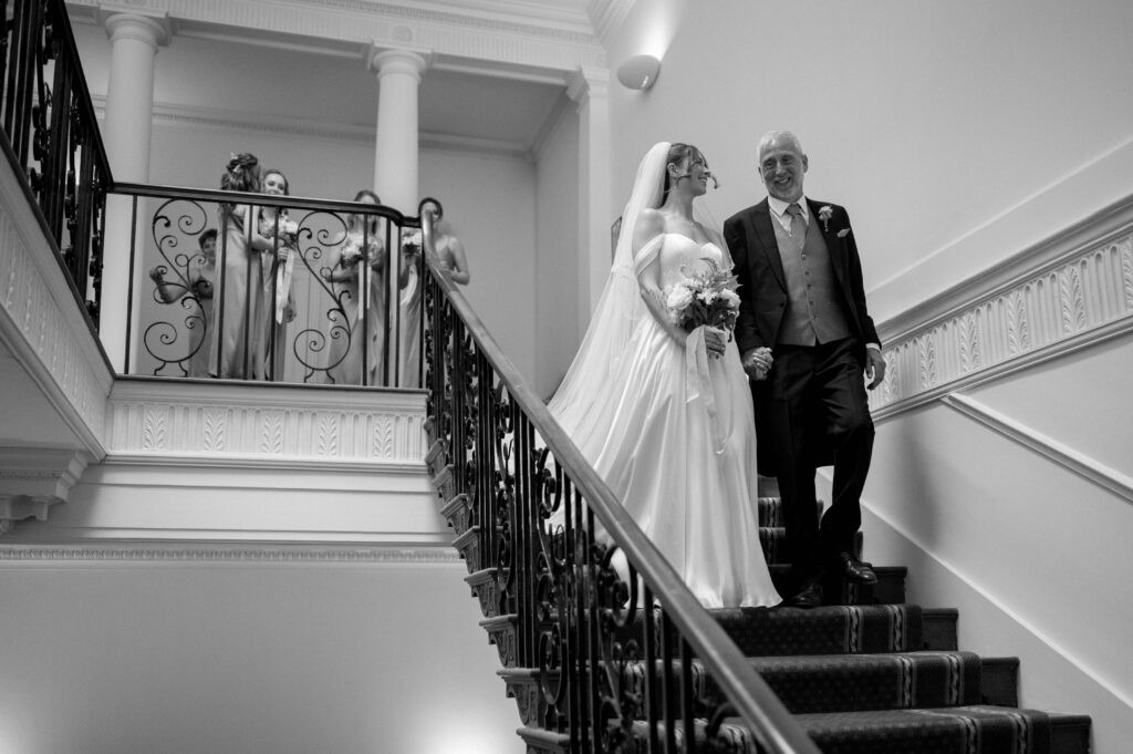 Black and white portrait of Charlie, the bride, with her father.