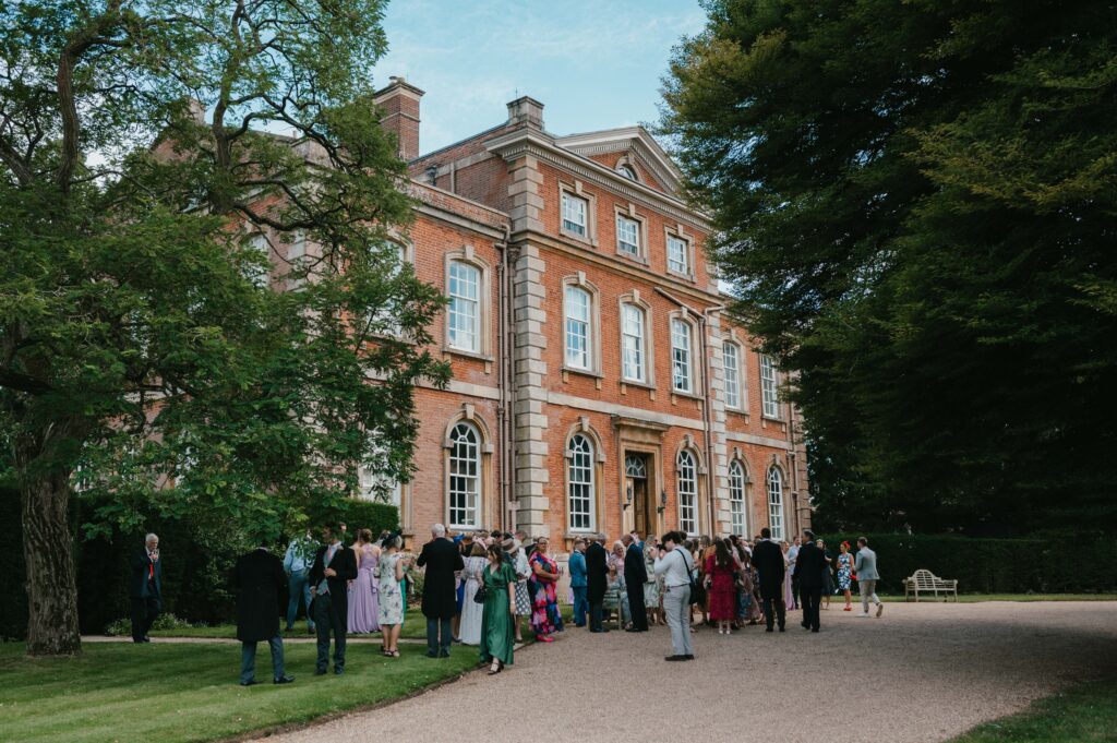 The stunning Kingston Bagpuize House, a picturesque venue for Amanda and John’s vibrant wedding celebration.