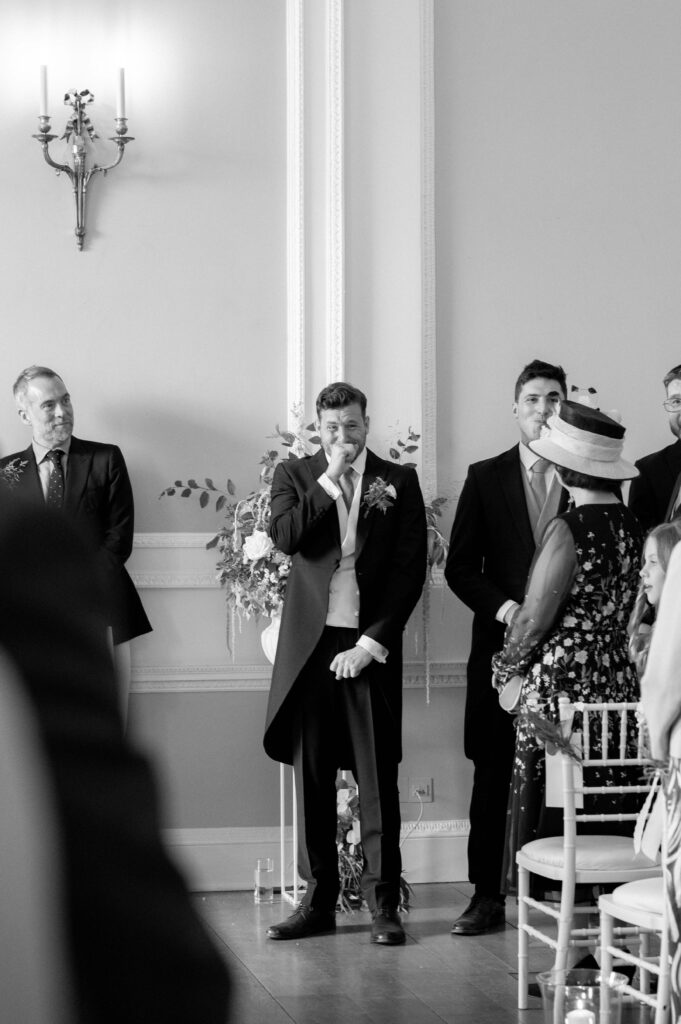 Close up of groom, Martin, crying when seeing his bride Charlie for the first time.