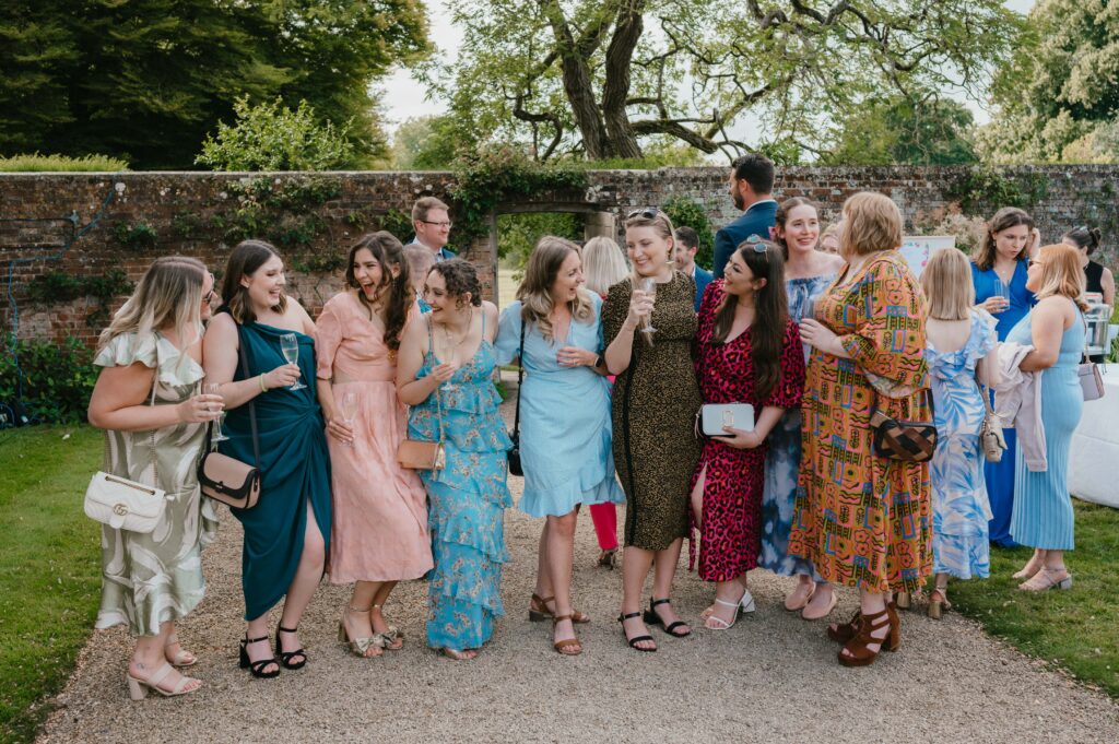 Guests arriving in colorful outfits, following Amanda and John's special request for a bright and joyful wedding day.