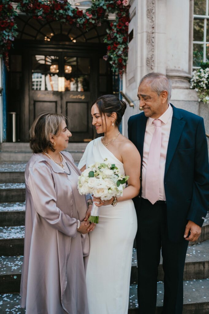 The bride with her mum and dad. 