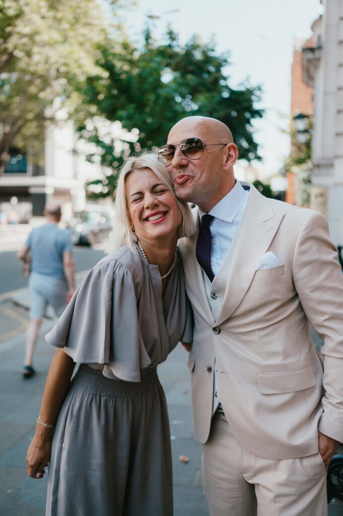 The groom holding his sister. 